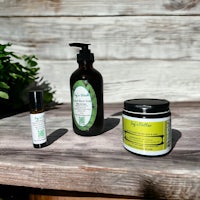 a wooden table with a bottle of lotion and a bottle of soap